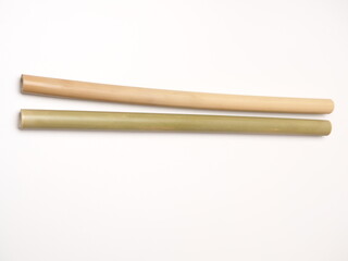 Close up shoot of a pair bamboo straw that more ecofriendly than plastic, shoot on a white isolated background
