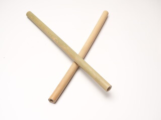 Close up shoot of a pair bamboo straw that more ecofriendly than plastic, shoot on a white isolated background