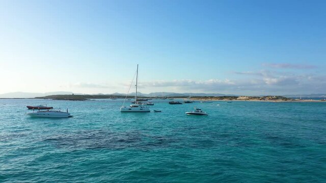 Aerial view of yachts in turquoise water near Formentera. Balearic Islands, Spain