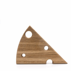 Kitchen utensils. Wooden cutting board, triangular in shape, similar to a slice of cheese, with holes. Isolated on a white background.