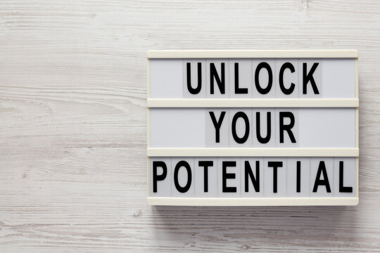 'Unlock your potential' words on a lightbox. Copy space.