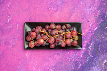 top view fresh red grapes inside cake pan on pink background wine fresh fruits color