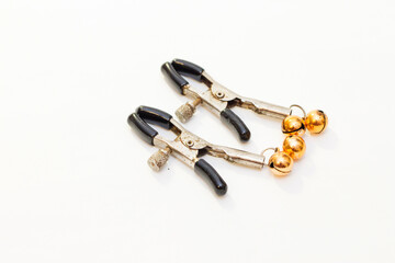 Two nipple clamps for BDSM games isolated on a white background