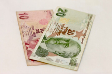 Ten turkish lira and twenty turkish lira paper currency laying isolated on the white