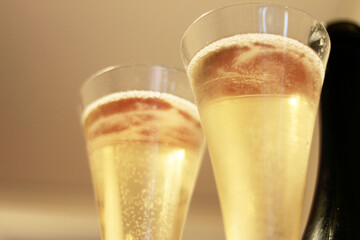 Bottle of champagne and a pair glasses