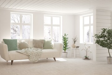 White living room with sofa and winter landscape in window. Scandinavian interior design. 3D illustration
