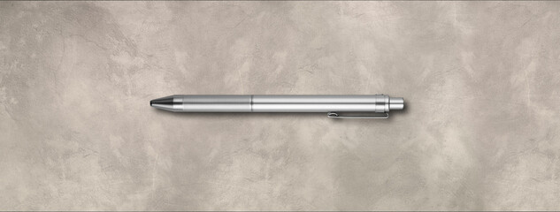 Metal pen isolated on concrete background