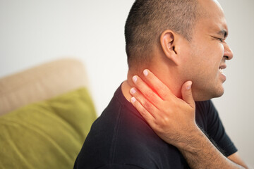 Young man has shoulder neck pain and hurt get stress a symptom office syndrome.