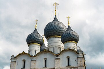 Fototapeta na wymiar Russia, Rostov, July 2020. Cloudy sky and domes of the Orthodox cathedral.