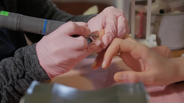 Professional nail care woman hands closeup