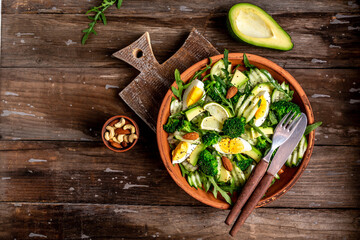Healthy food. Fresh green salad on black background, Long banner format. Food recipe background. Close up