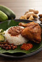 Nasi Kukus is usually comprising freshly steamed rice and crispy fried chicken
