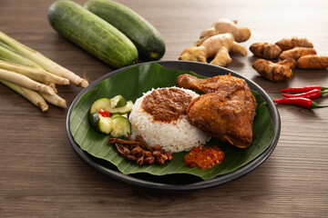 Nasi Kukus is usually comprising freshly steamed rice and crispy fried chicken