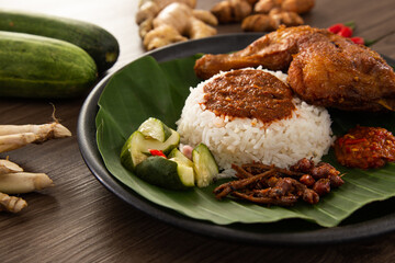 Nasi Kukus is usually comprising freshly steamed rice and crispy fried chicken