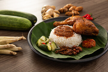 Nasi Kukus is usually comprising freshly steamed rice and crispy fried chicken