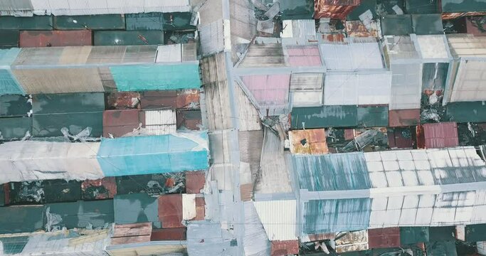 Aerial Top-down View High Altitude Of Slum A Heavily Populated Urban Informal Settlement Characterized By Substandard Housing And Squalor Poor Living Conditions Streets And Rusty Metal Home Roof Tops