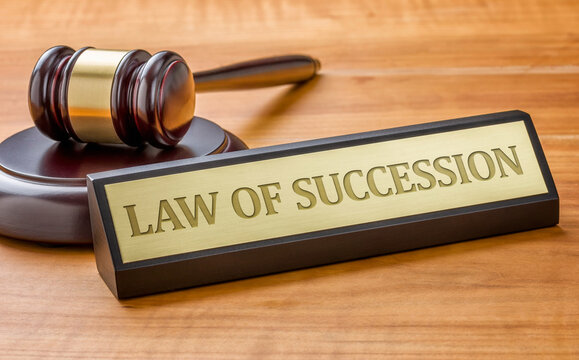 A Gavel And A Name Plate With The Engraving Law Of Succession