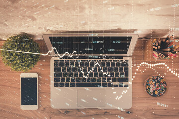 Multi exposure of financial chart drawing over table background with computer. Concept of research. Top view.