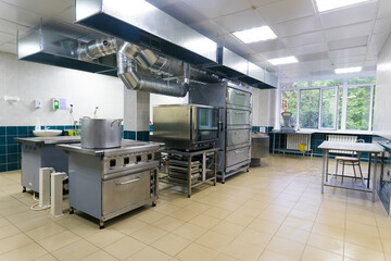 Restaurant kitchen equipment for preparing food, meal, plates, detail.