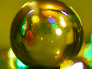 Defocused Festive photography. Holidays composition. Rosebud crystal candlestick in front of the...