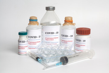 Coronavirus Vaccine injection vials medicine drug bottles Covid-19 with syringe