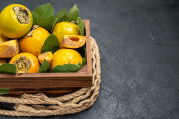 front view fresh sweet persimmons inside box on the dark background tree taste fruit ripe
