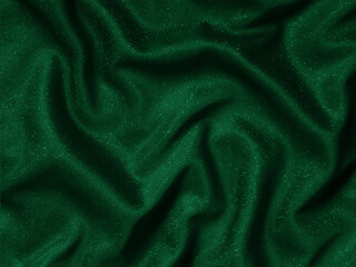Shiny green emerald crumpled fabric texture. Elegant cloth background