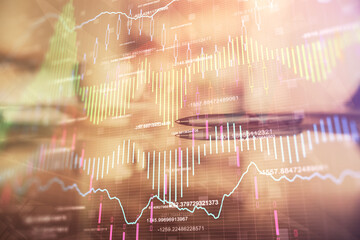 Double exposure of forex chart over coffee cup background in office. Concept of financial analysis...