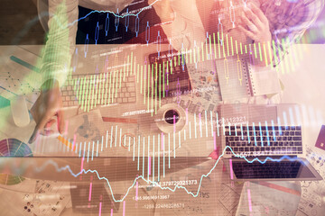 Double exposure of man and woman working together and financial chart hologram drawing. market analysis concept. Computer background. Top View.