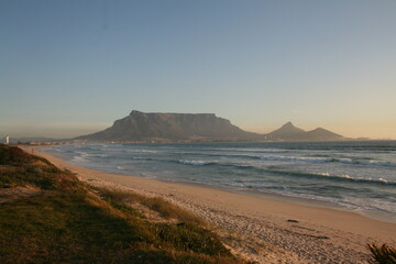 view of the beach at sunset and table mountan