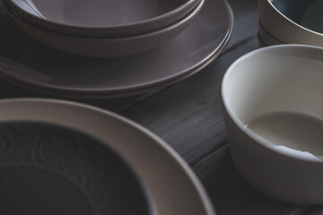 black and white plates and bowls on a wooden background