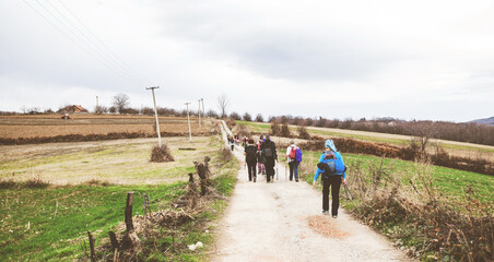 Fototapeta na wymiar active people trekking on rural landscape