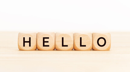 Hello word in wooden blocks on table. Copy space