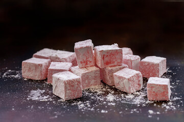 Turkish delight with rose flavor on a black background