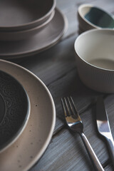 black and white plates and bowls on a wooden background