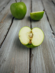 green apple on white wooden background