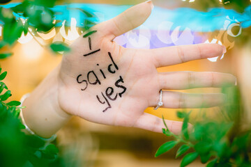  Just engaged girl showing her hand written that she said yes