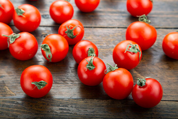 Ripe tomatoes on a wooden background. Harvesting concept.