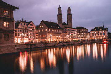 VIew of Grossmünster Church across the Limmit River in Zurich, Switzerland