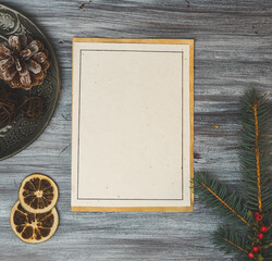 Christmas card on a white wooden background with decorations