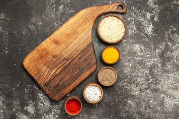 top view raw rice with seasonings on dark background raw food spice