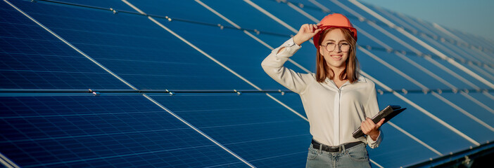 Inspector Engineer Woman Holding Digital Tablet Working in Solar Panels Power Farm, Photovoltaic...