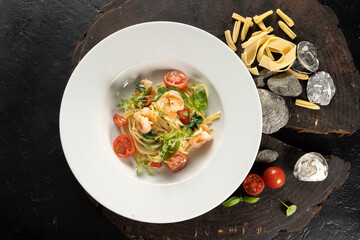 Pasta with prawns. Spaghetti, shrimps, garlic, chili, butter, grana padano. A hot main course with seafood.