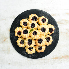 Sweet cookies with cherry filling. Sweet pastries and dessert. Top view.