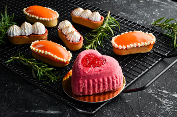 Sweet cream dessert with cherries in the shape of a heart. Top view. Sweets.