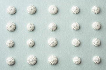 Small white meringues on the table.