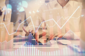 Double exposure of forex chart sketch hologram and woman holding and using a mobile device. Financial market concept.