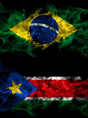 Brazil, Brazilian vs South Sudan smoky mystic flags placed side by side. Thick colored silky abstract smoke flags.