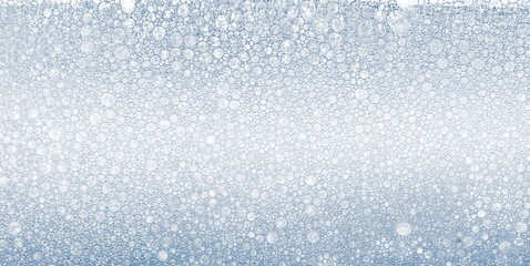 Foam blue texture soap bubbles on the water abstract background