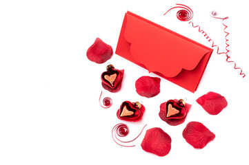 Red ribbon in the form of serpentine and red glass hearts and envelope